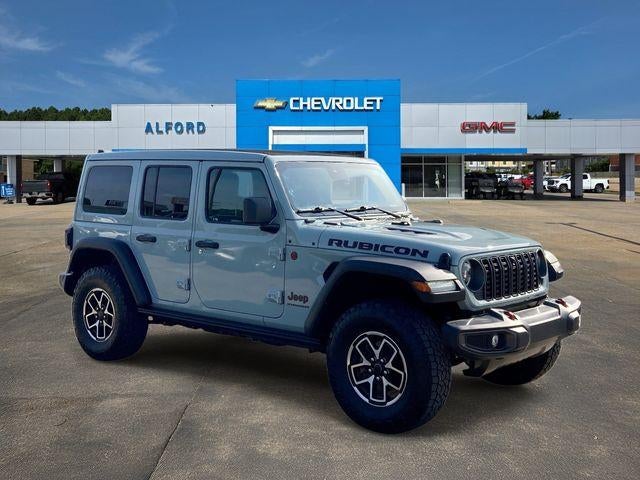 2024 Jeep Wrangler Rubicon in Earl Clearcoat — front three-quarter view