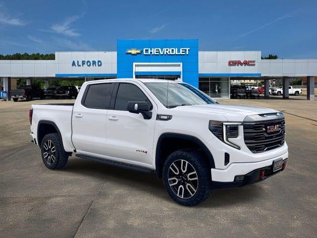 2024 GMC Sierra 1500 AT4 in Summit White — front three-quarter view